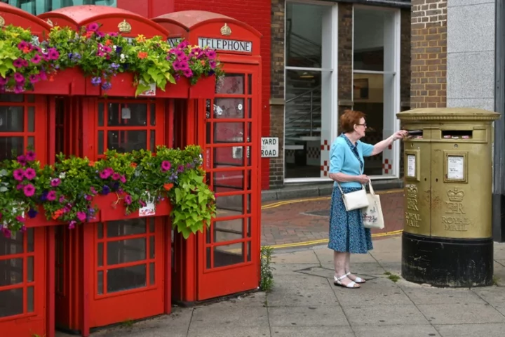 Ruling UK Conservatives suffer vote routs but avoid wipeout