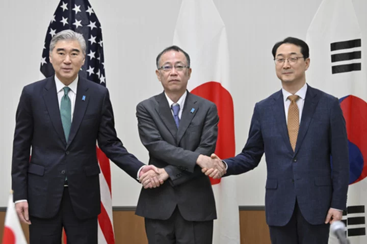 Japanese, US and South Korean officials condemn the North's weapons plans but urge dialogue