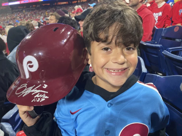 Phillies' Harper flips out on ump, tosses helmet into the stands where it's retrieved by 10-year-old