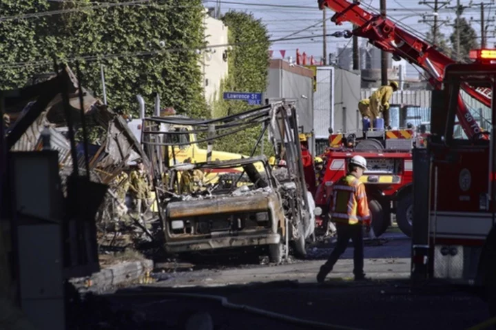 After massive fire closes Los Angeles interstate, motorists urged to take public transport