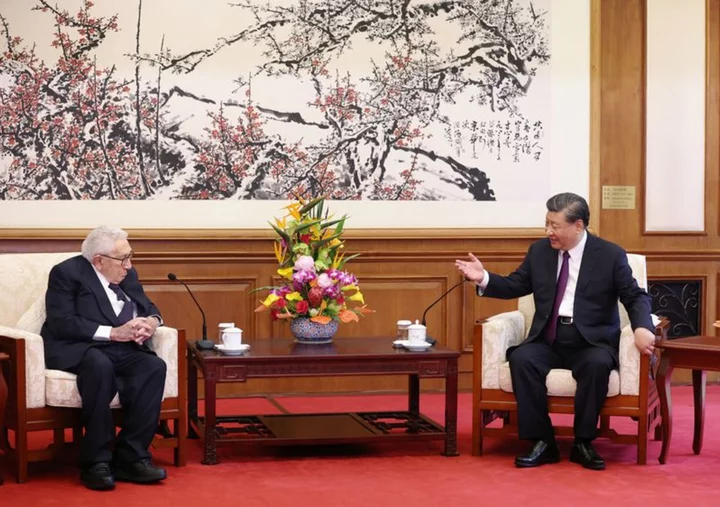 China's Xi gets nostalgic with 'old friend' Kissinger