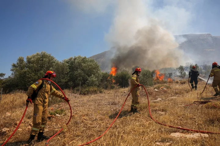 Watch live as wildfires rage and smoke rises across coastal towns in Greece