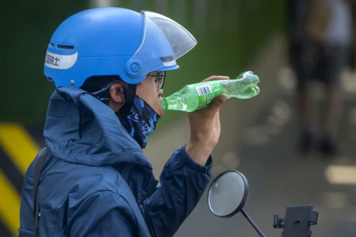 Beijing sizzles under nearly all-time-high temperatures as authorities ask people to stay indoors