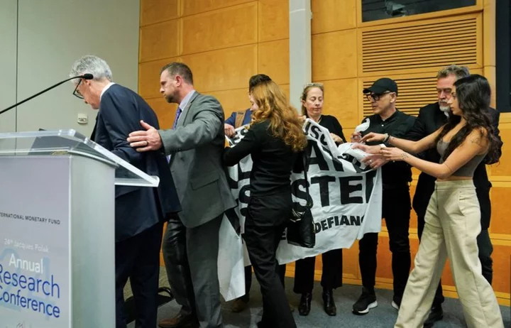 Climate activists briefly disrupt Fed chair's speech