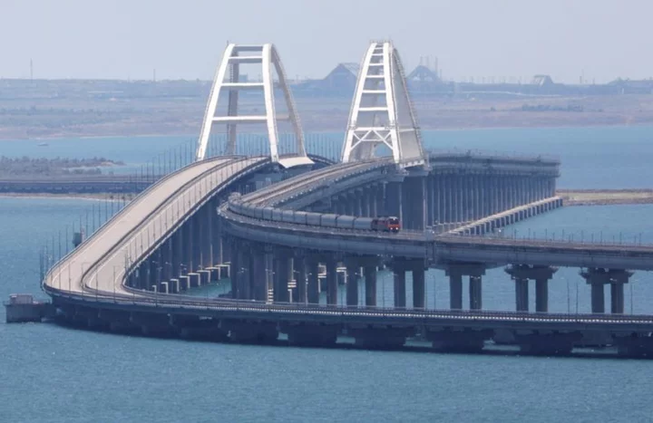 Russian tourists flee Crimea after attack on landmark bridge