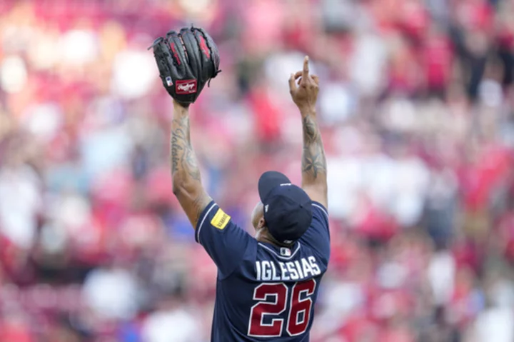 Reds' 12-game winning streak ends as Braves prevail 7-6 in 8-homer slugfest