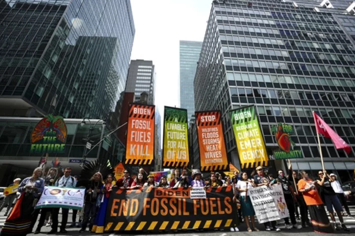 Thousands march to kick off climate summit, demanding an end to warming-causing fossil fuels