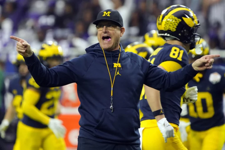 Michigan's Harbaugh tells team he will serve 3-game suspension for NCAA violations, AP sources say