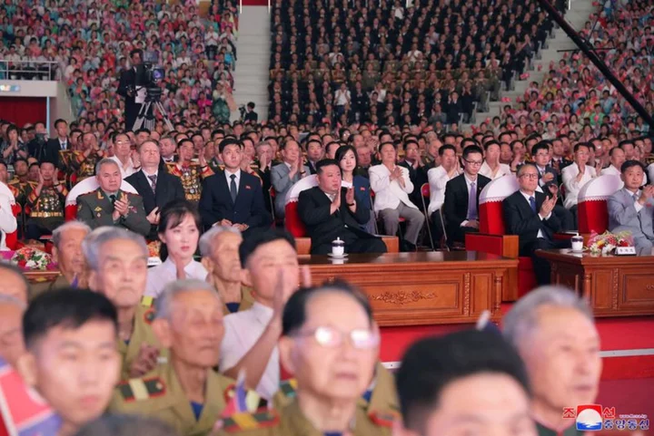 North Korea shows off drones and ballistic missiles at night-time parade