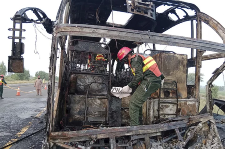 Bus engulfed in flames after hitting van in Pakistan, killing 18 people and injuring 13 others