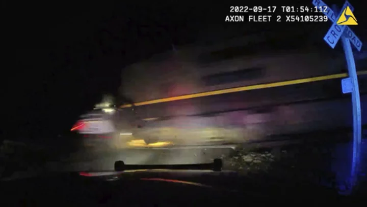 Colorado officer who put suspect in car hit by train found guilty of reckless endangerment