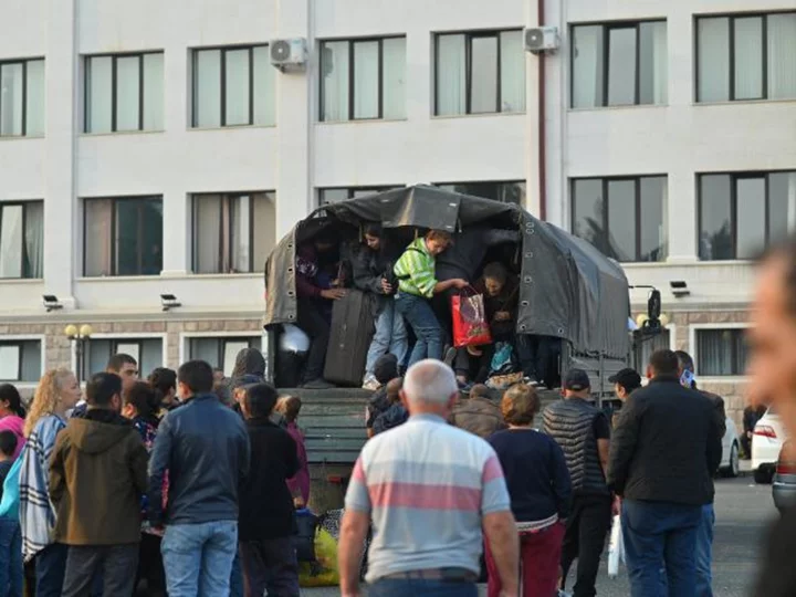 Thousands of ethnic Armenians flee Nagorno-Karabakh after breakaway region's defeat