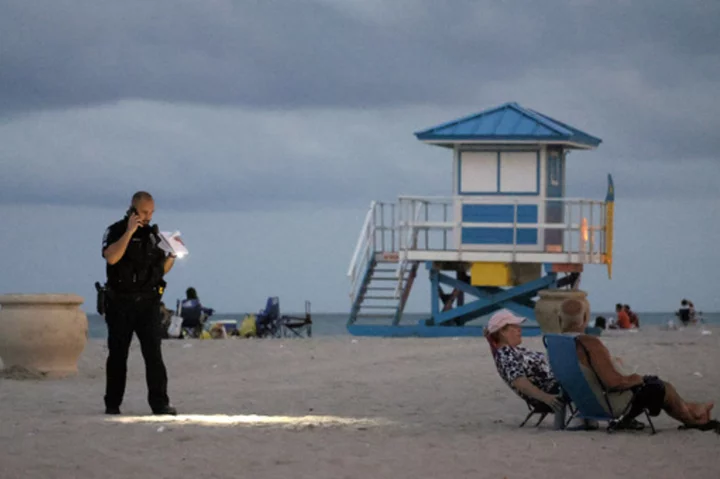 Florida police arrest man, search for 2 others in Memorial Day beach shooting