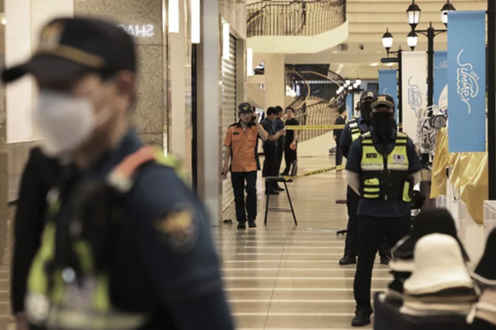 13 injured in South Korea when a man rams a car onto a sidewalk, stabs pedestrians