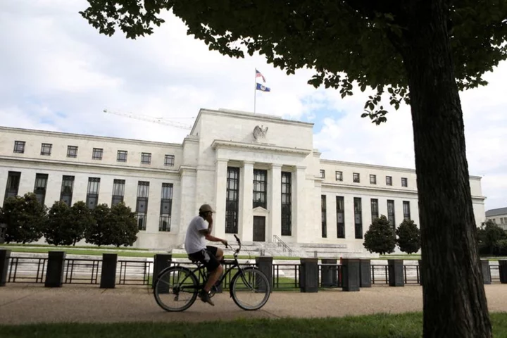 Fed leaves interest rates unchanged, sees tighter policy through 2024