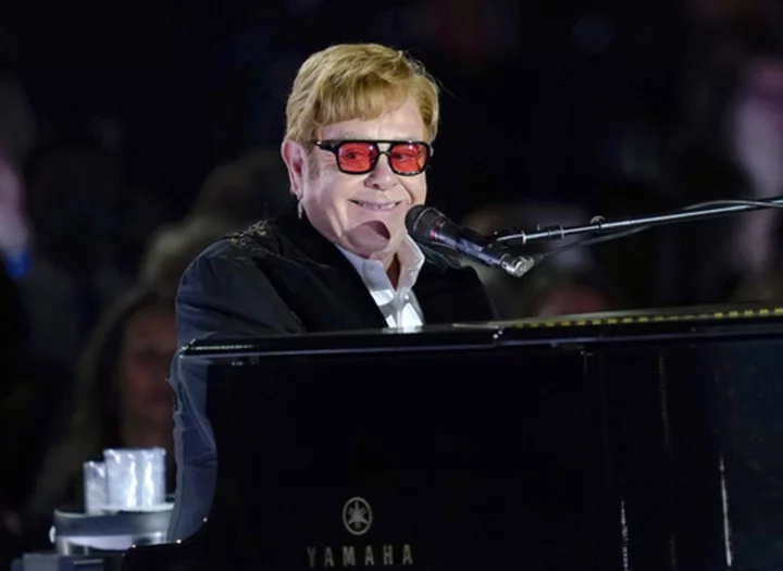 Elton John addresses Britain's Parliament, urging lawmakers to do more to fight HIV/AIDS