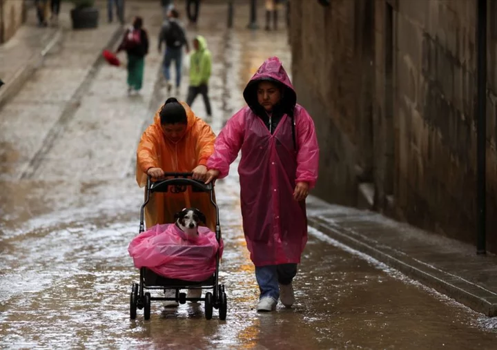 Madrid residents told to stay at home as torrential rain sweeps across Spain