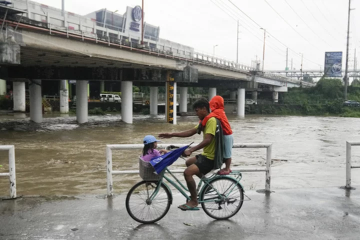 Taiwan shuts down schools and offices as Typhoon Doksuri scrapes the island's coast