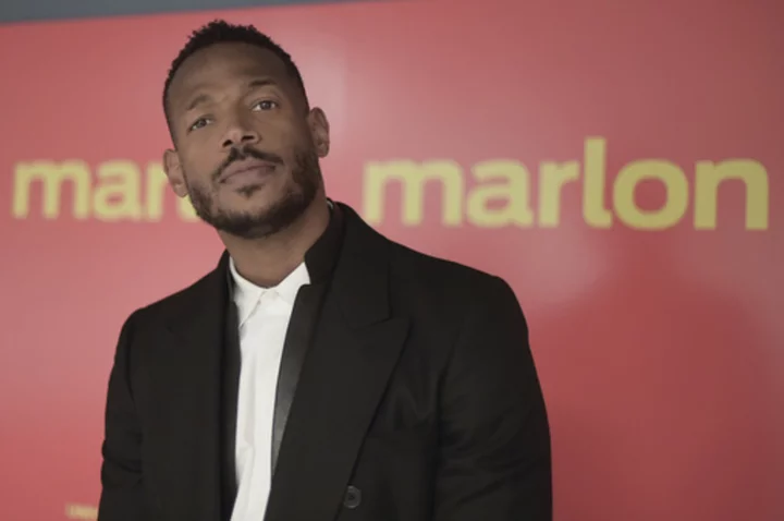 Marlon Wayans says he is being unfairly prosecuted after being by racially targeted by gate agent