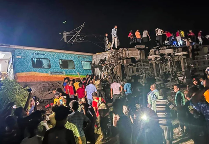 Passenger train derails in India, killing at least 50 and trapping many others