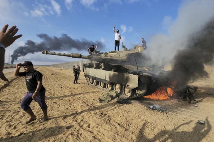 AP PHOTOS: Death, destruction and despair reign a month into Israel-Hamas war