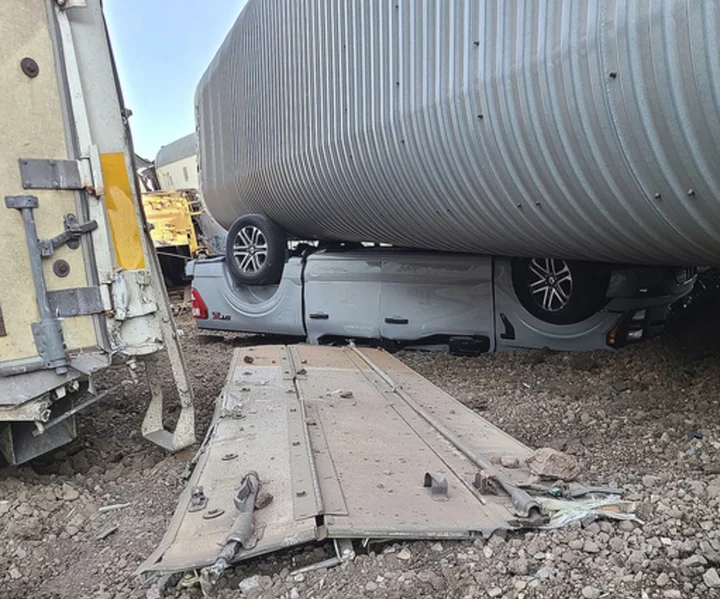 23 freight cars, new vehicles heavily damaged in train derailment in northern Arizona