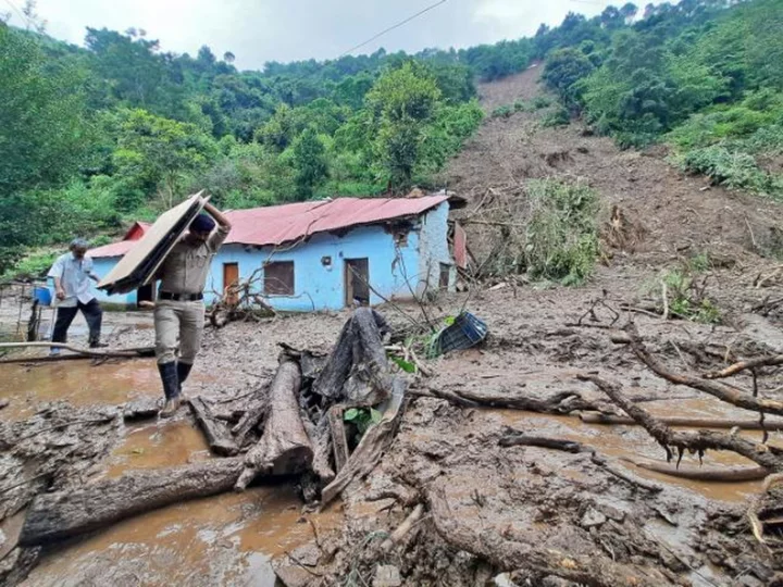 Up to 25 people trapped under a collapsed temple in northern India as heavy rains kill at least 41 people