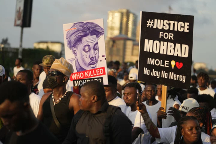 Nigerians protest mysterious death of Afrobeat star as police exhumes body for autopsy