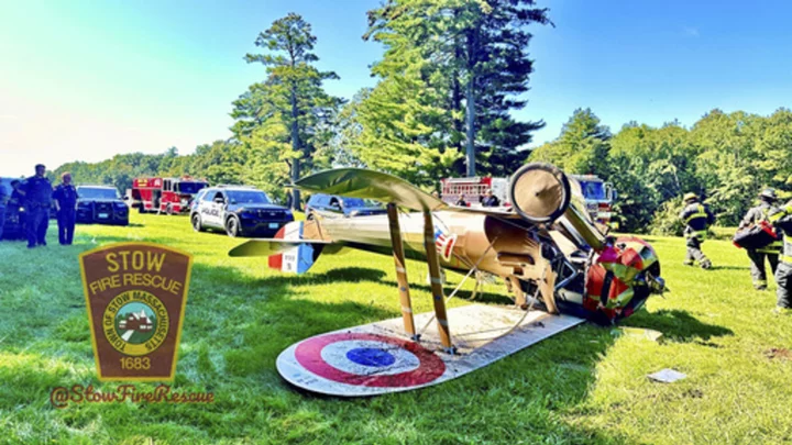 World War I-era plane flips onto roof trying to land near Massachusetts museum; pilot unhurt