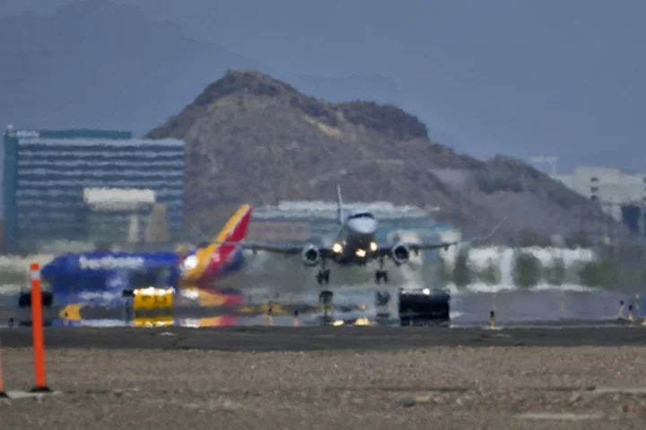 Suffocating heat wave in metro Phoenix starts easing after first major monsoon storm of the season