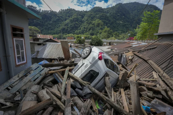 Indian rescue copters are flying into region where flood washed out bridges and killed at least 52