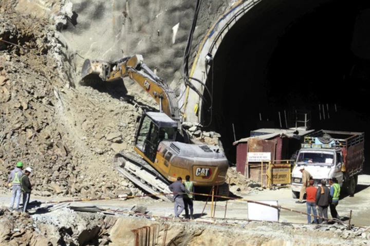 Blocked from a horizontal route, rescuers will dig vertically to reach 41 trapped in India tunnel