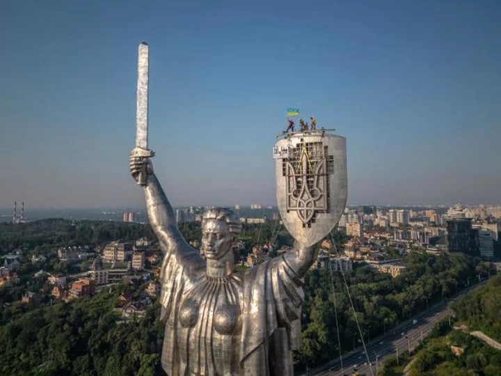 Ukraine replaces Soviet-era hammer and sickle symbol with a trident on Kyiv statue