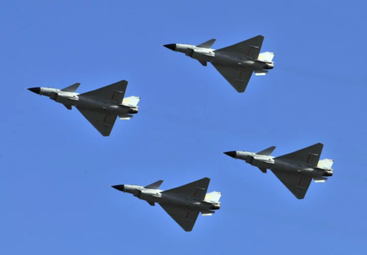 As Taiwan prepares for anti-invasion exercises, China sends dozens of warplanes toward the island