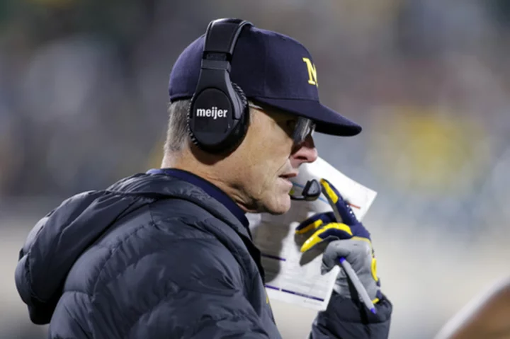 Michigan is accused of stealing other team's signs. Here's why its coach just got banned for 3 games