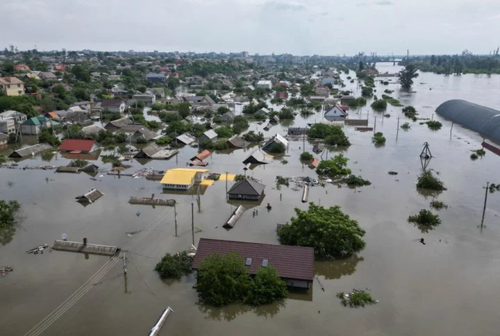 Hundreds plucked from flooded homes; Ukraine dismisses counteroffensive reports