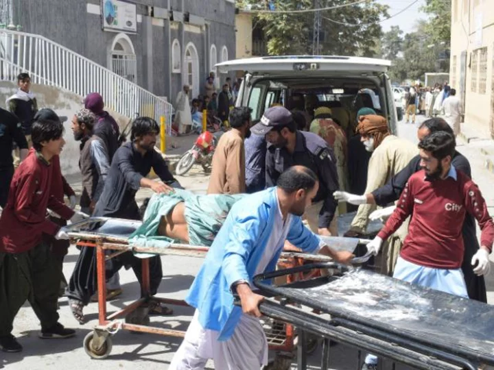 At least 52 killed after blast rips through religious procession in restive southwest Pakistan