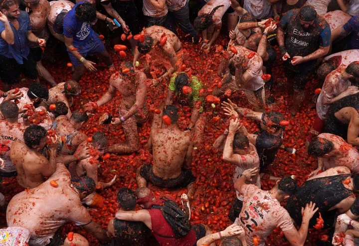 Streets awash with red pulp as Spanish town holds tomato-hurling festival