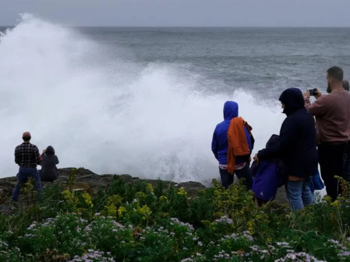 Lee knocks out power to tens of thousands as it brings fierce winds and coastal flooding to Maine and Canada