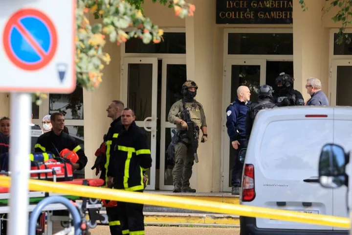 French high school where teacher was killed Friday evacuated over bomb alert